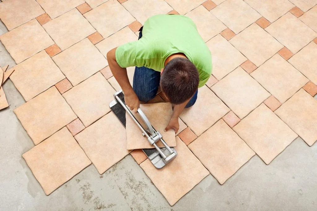 Flooring professional installing tile floors