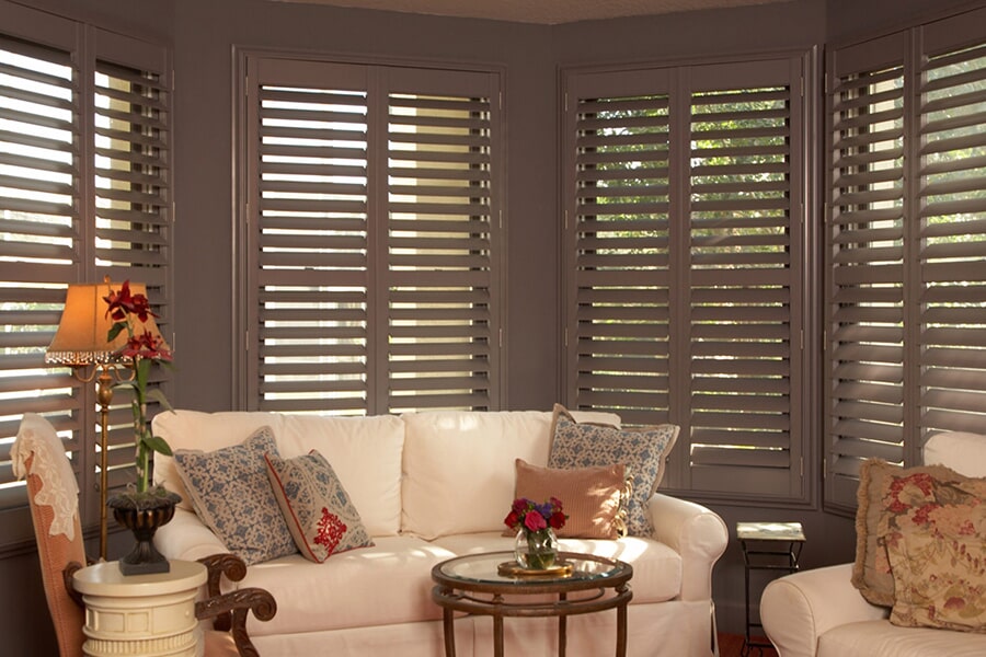 Cozy living room with dark brown plantation shutters