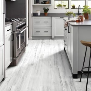 Durable Luxury Vinyl flooring in a white and grey kitchen