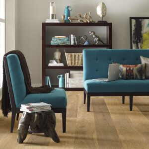 Living room with blue chairs and oak hardwood floors, modern and comfortable