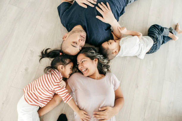 Happy family laying on carpet
