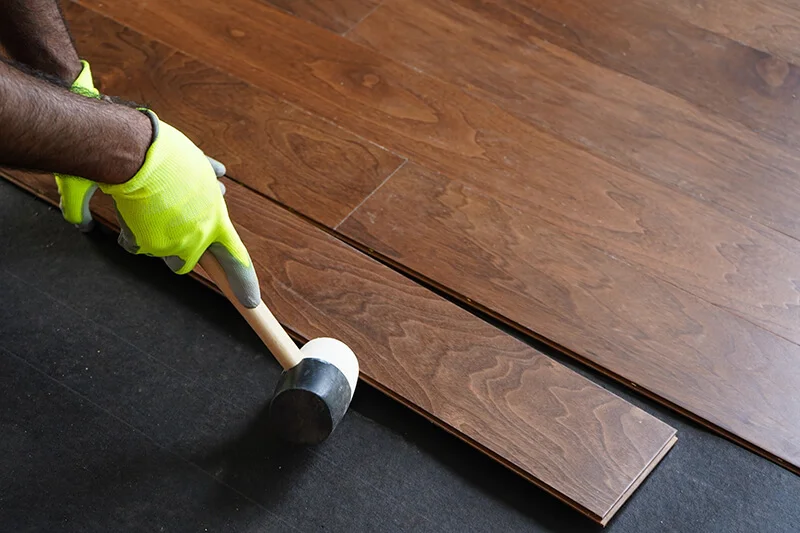 Floor professional installing hardwood flooring