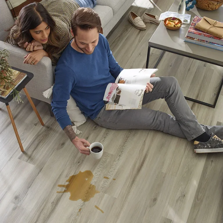 Couple reading and spilling coffee on waterproof floors
