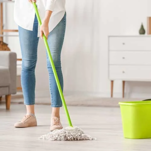 Woman mopping laminate flooring